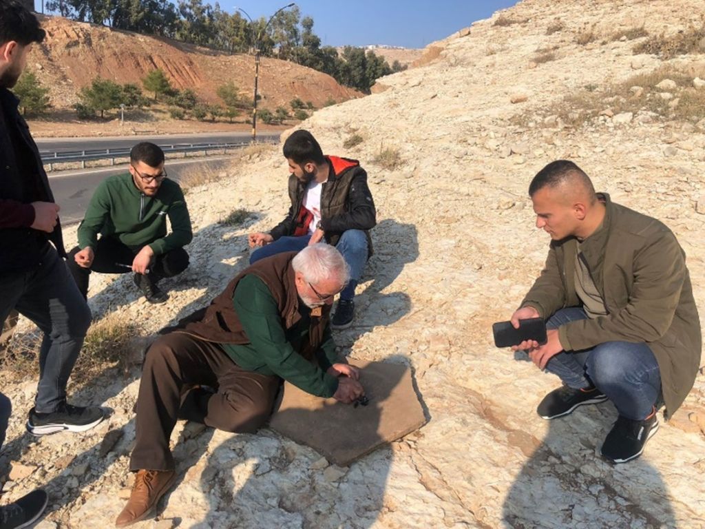 Petroleum and Mining Engineering, geological field trip, TIU, Erbil, Shaqlawa, rock formations, Upper Bakhtiari, Pirmam Anticline, dip and strike, lithology, structural geology, second-grade students, geology education.