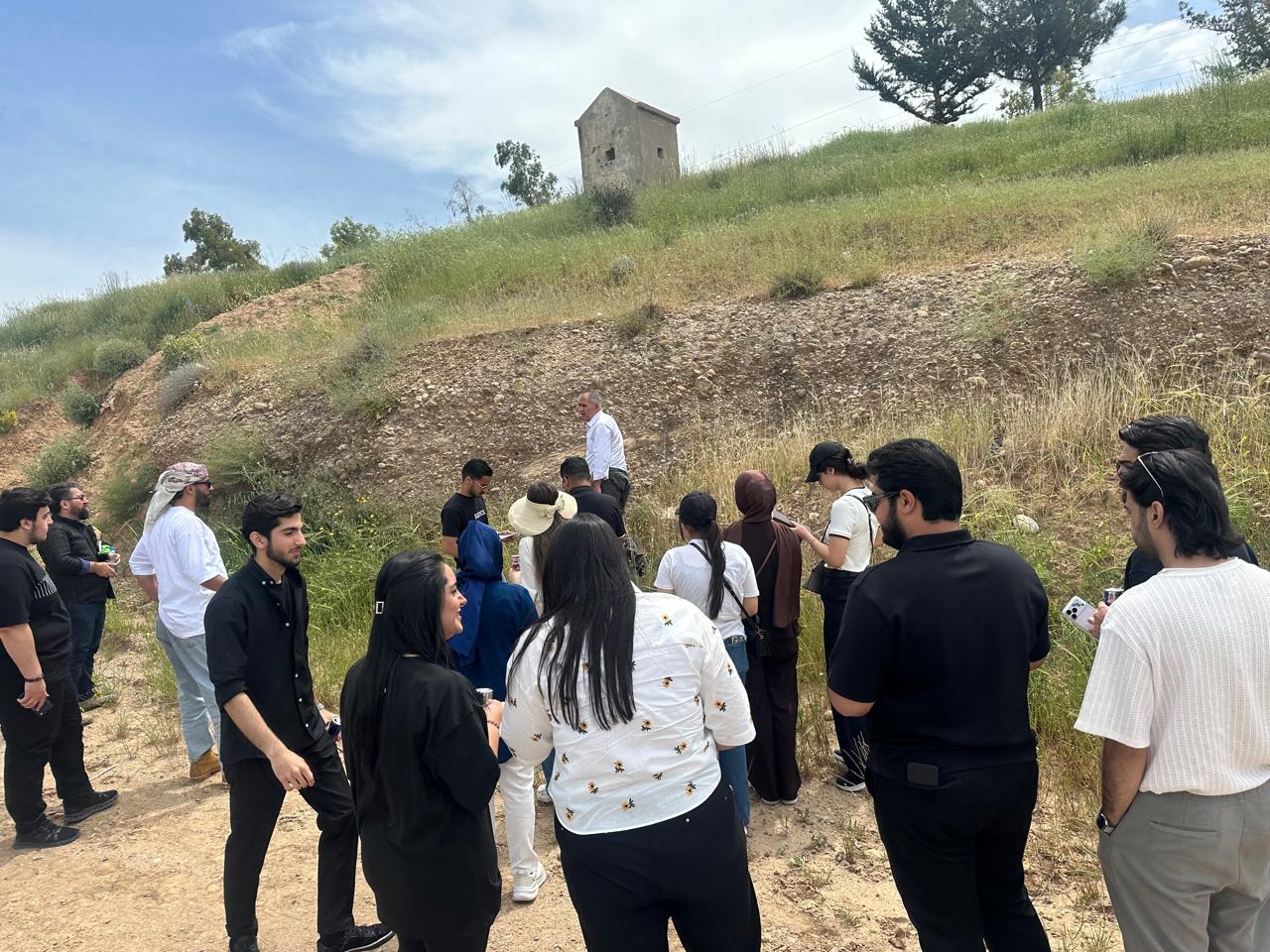 Students observing sedimentary rock formations