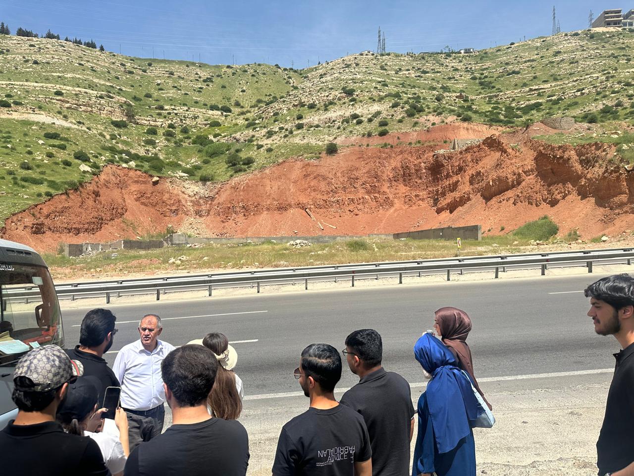 Students observing sedimentary rock formations