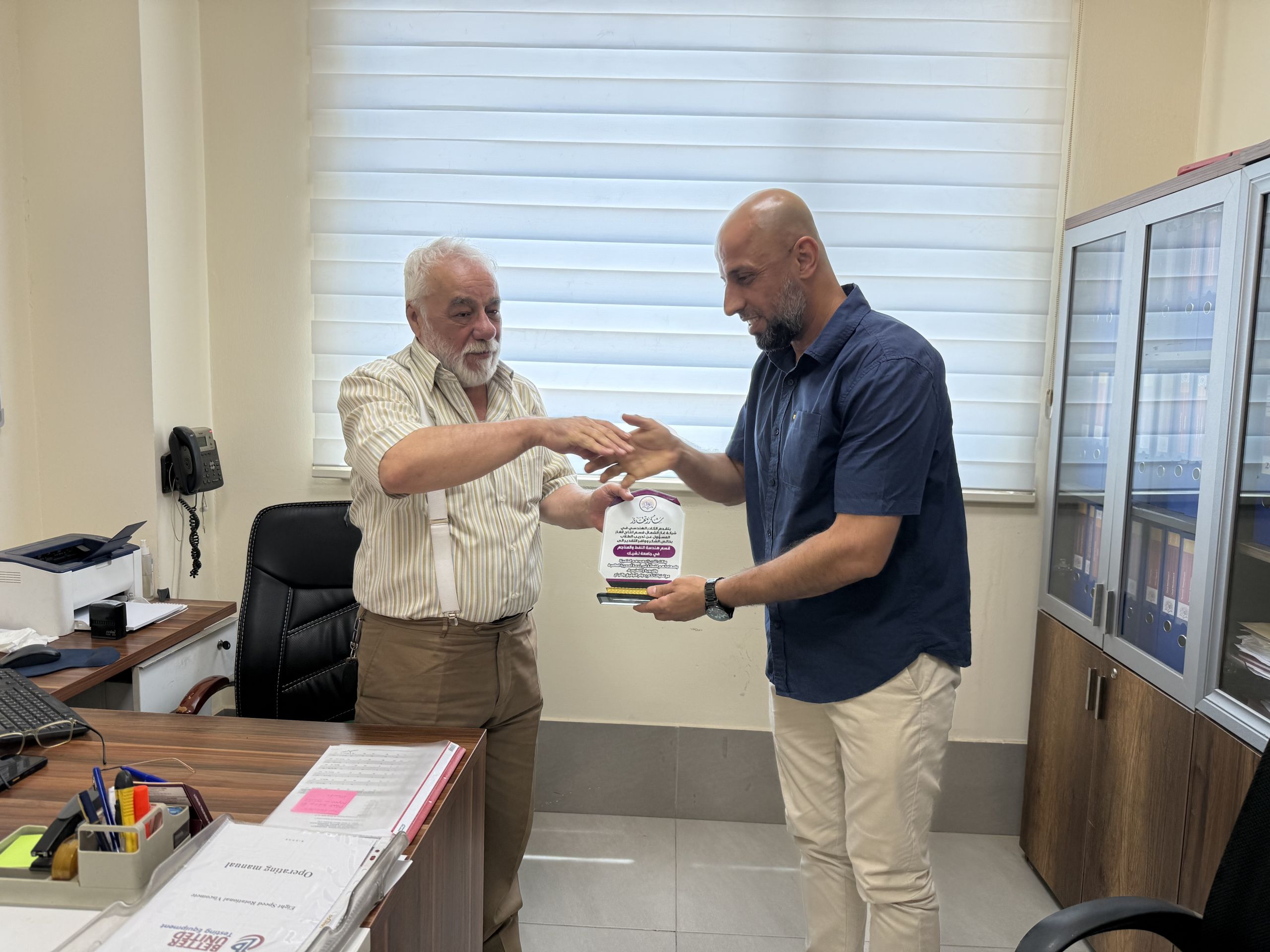 Prof. Dr. Fadhil Ali welcoming North Gas Company engineers to his office.